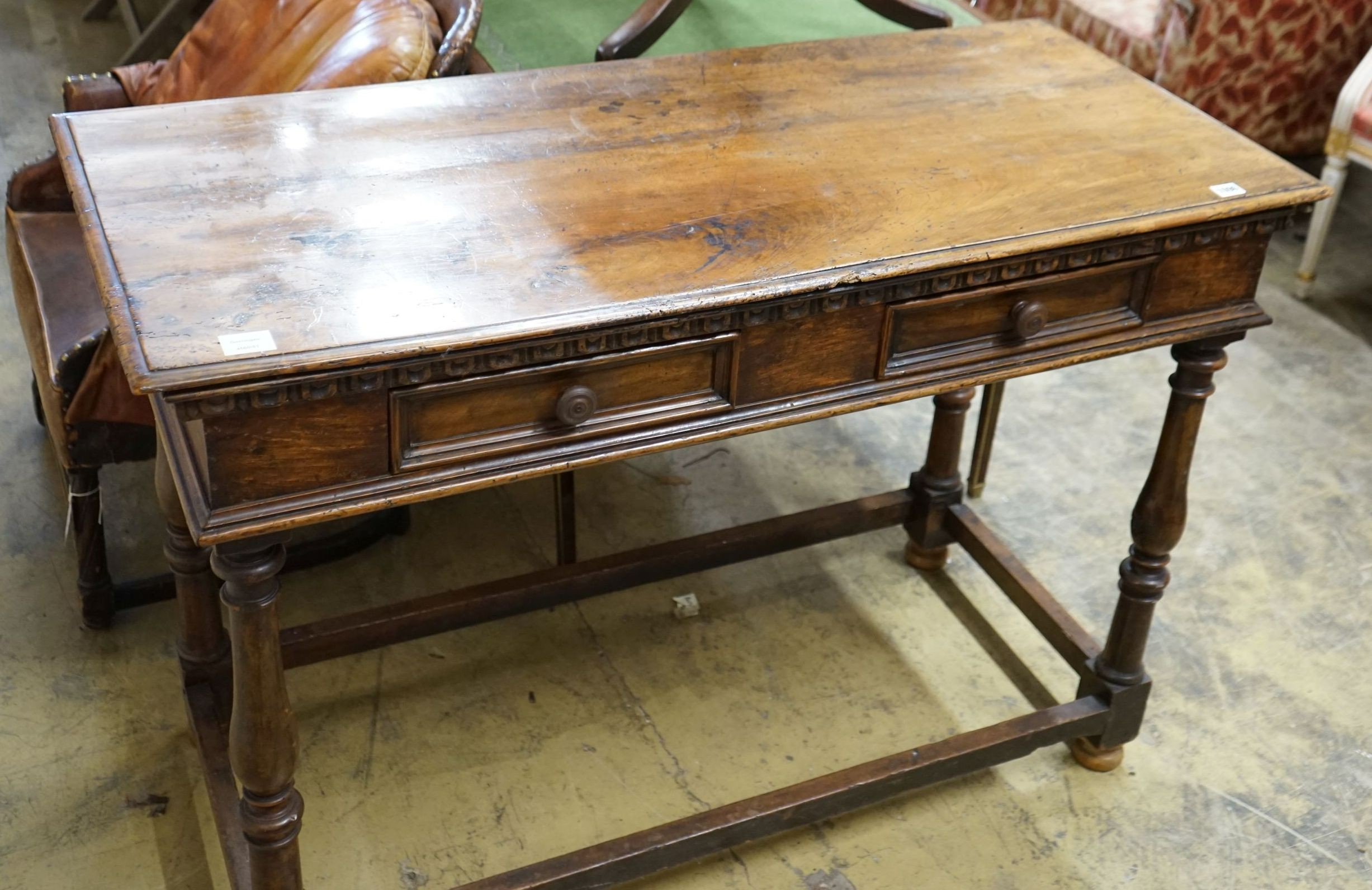 A Tuscan style walnut hall table with frieze drawers over turned legs united by stretchers, width 120cm, depth 55cm, height 85cm